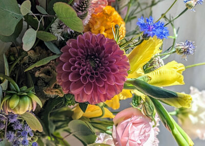 Pink and yellow flower arrangement.