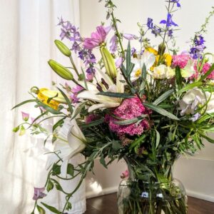 A large vase full of flowers.