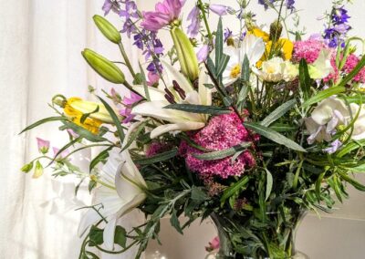 A large vase full of flowers.