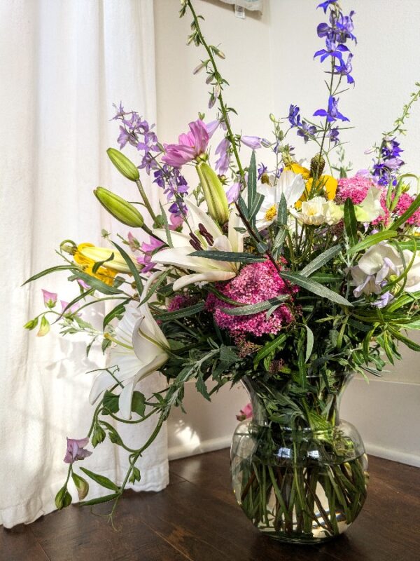 A large vase full of flowers.