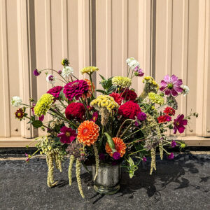 Bold flowers in a metallic vase.