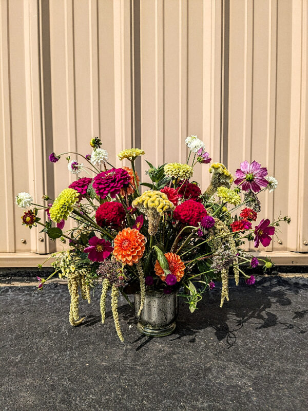 Bold flowers in a metallic vase.