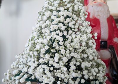 A small Christmas tree made of baby's breath flowers.